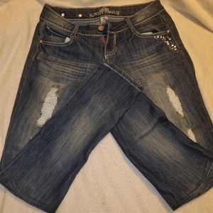 Studded, distressed stretch jeans
